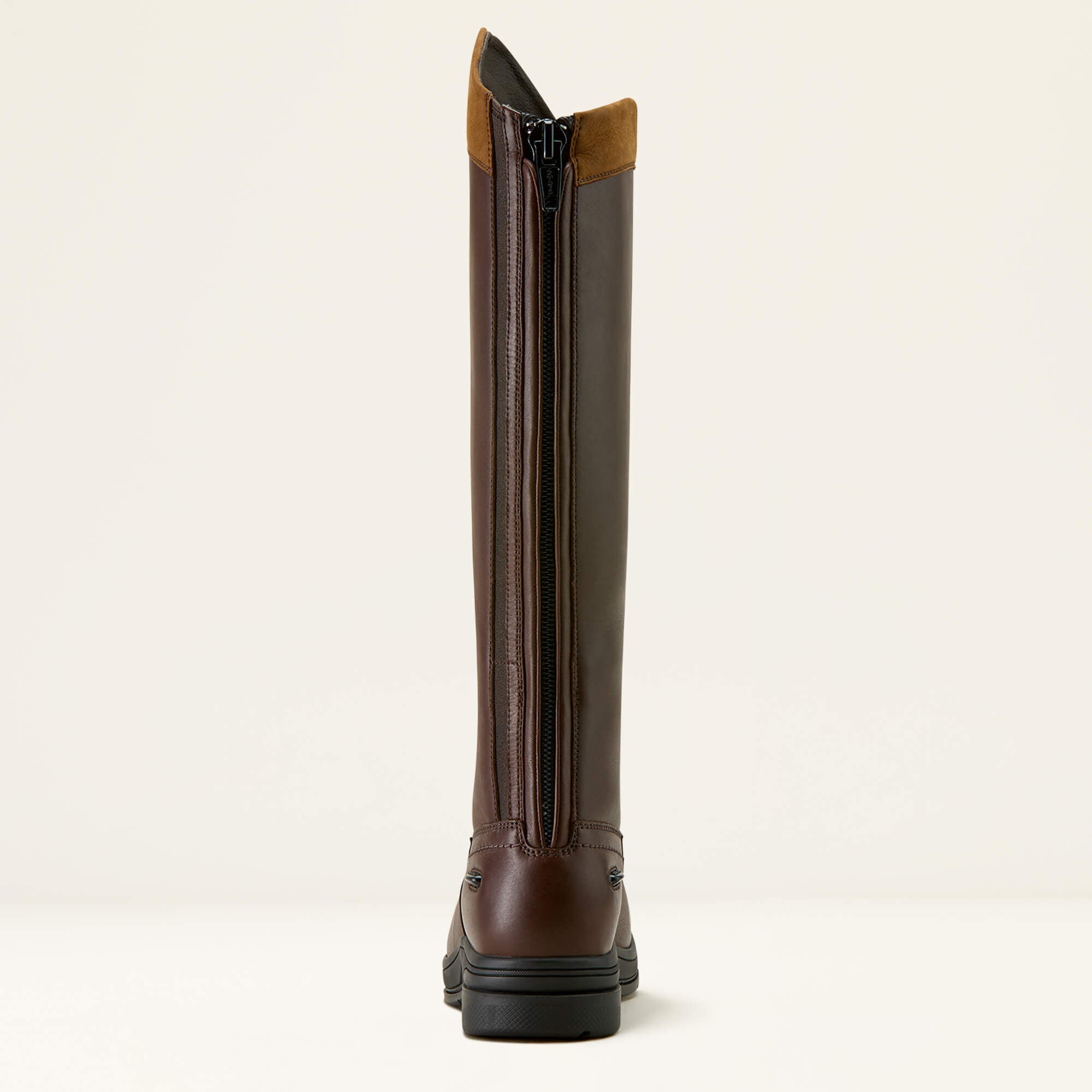 Brown Ariat Stamford Waterproof Boot with a back zipper on a beige background