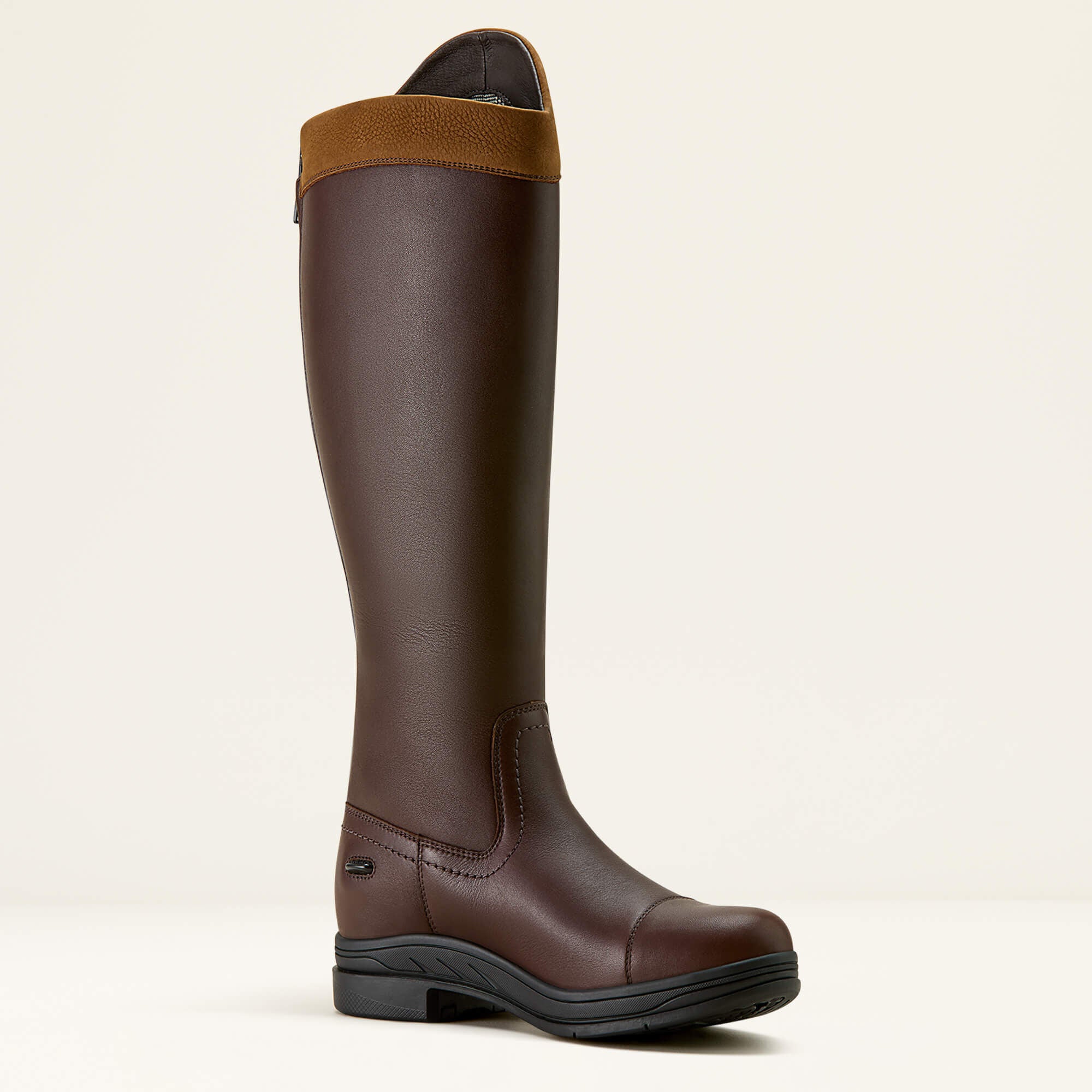Brown Ariat Stamford Waterproof knee-high boot with a brown band on a beige background