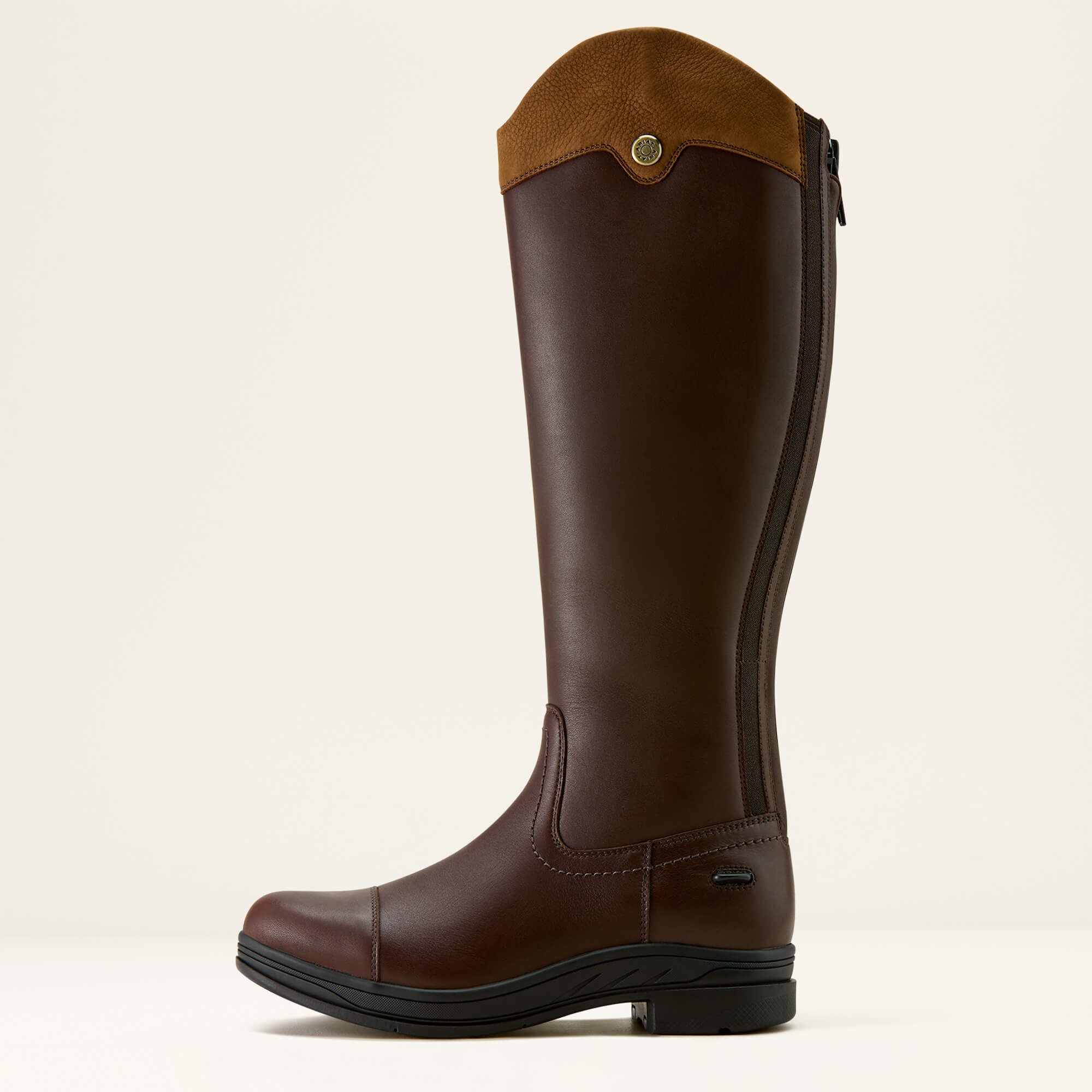 Brown Ariat Stamford Waterproof boot with a tan top on a beige background