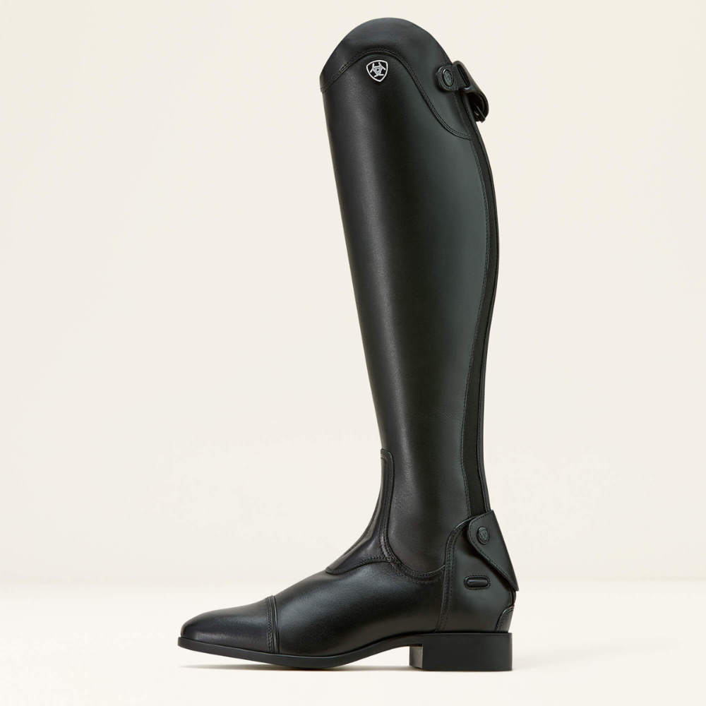 Side image of a left Ariat black  Palisade tall dress riding boot on white background.