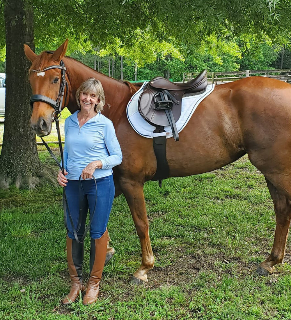 Image of M & M Tack Shop owner Michele Karowski and her chestnut mare Donna Sera.