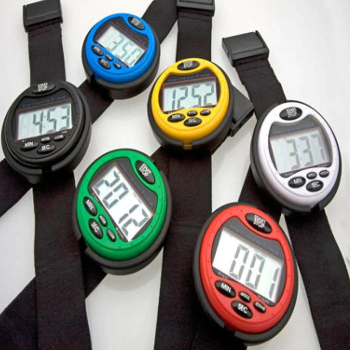 A collection of Optimum Time equestrian event watches in various colors, displayed on black straps with digital screens showing various times.