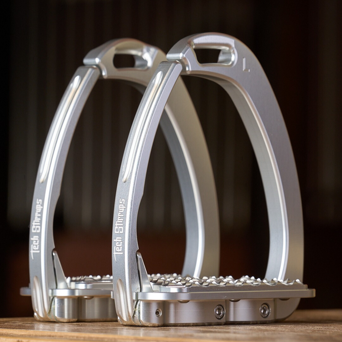 A silver pair of Tech Venice Hunter Jumper Safety Stirrups.