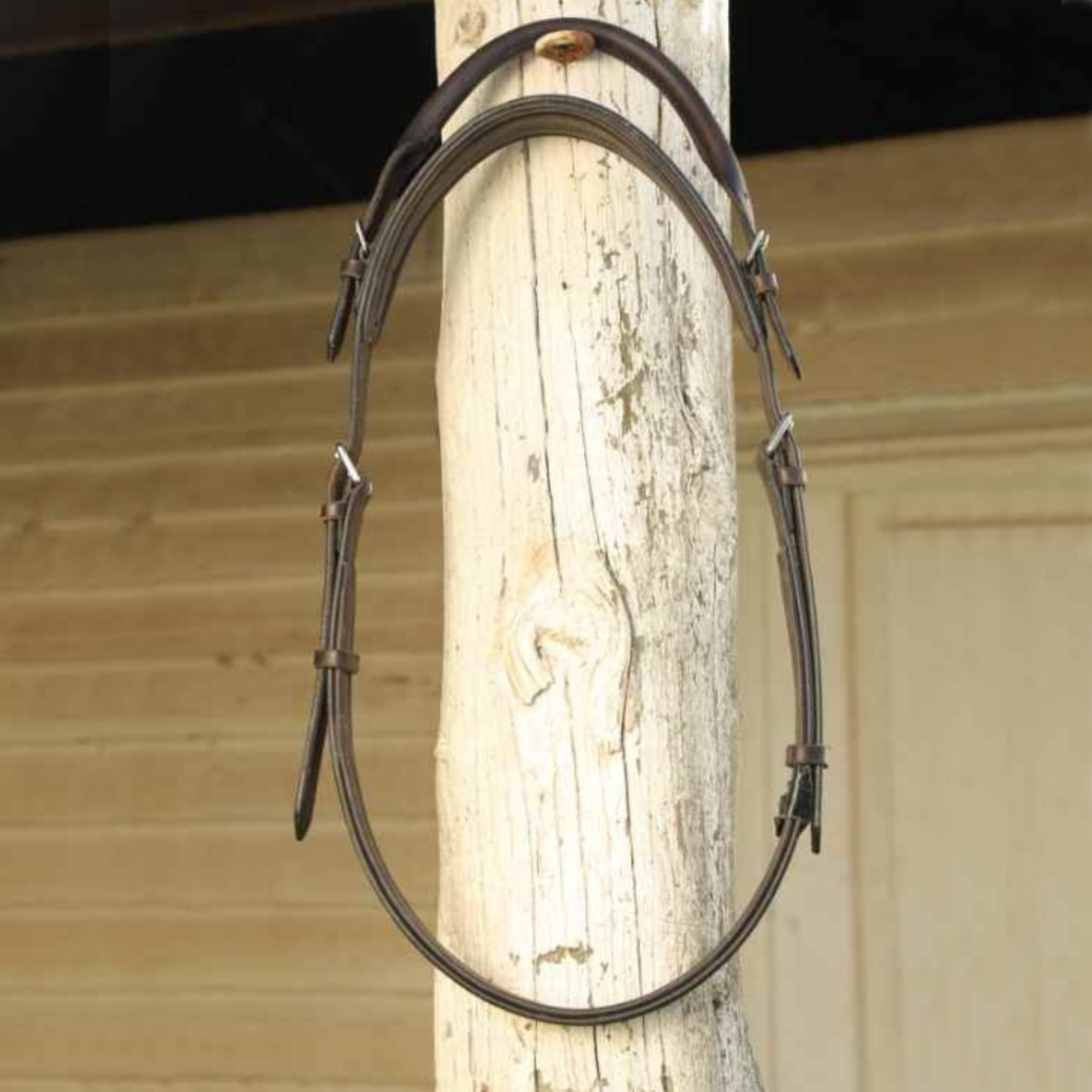 Correct Connect Neck Strap hanging on a hook.