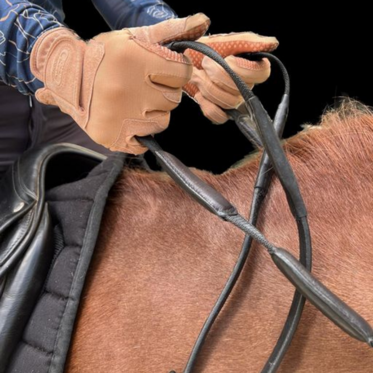 Black correct connect reins with padded grips.