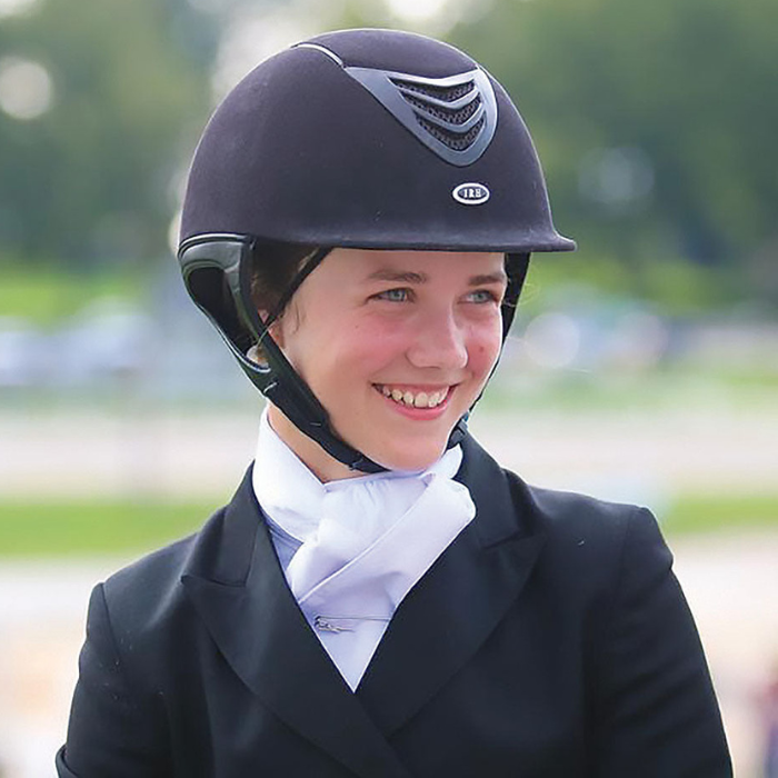 Dressage rider wearing an IRH IR4G Competitors Choice Suede Finish Long Oval Helmet, Black Amara Suede/Matte Vent