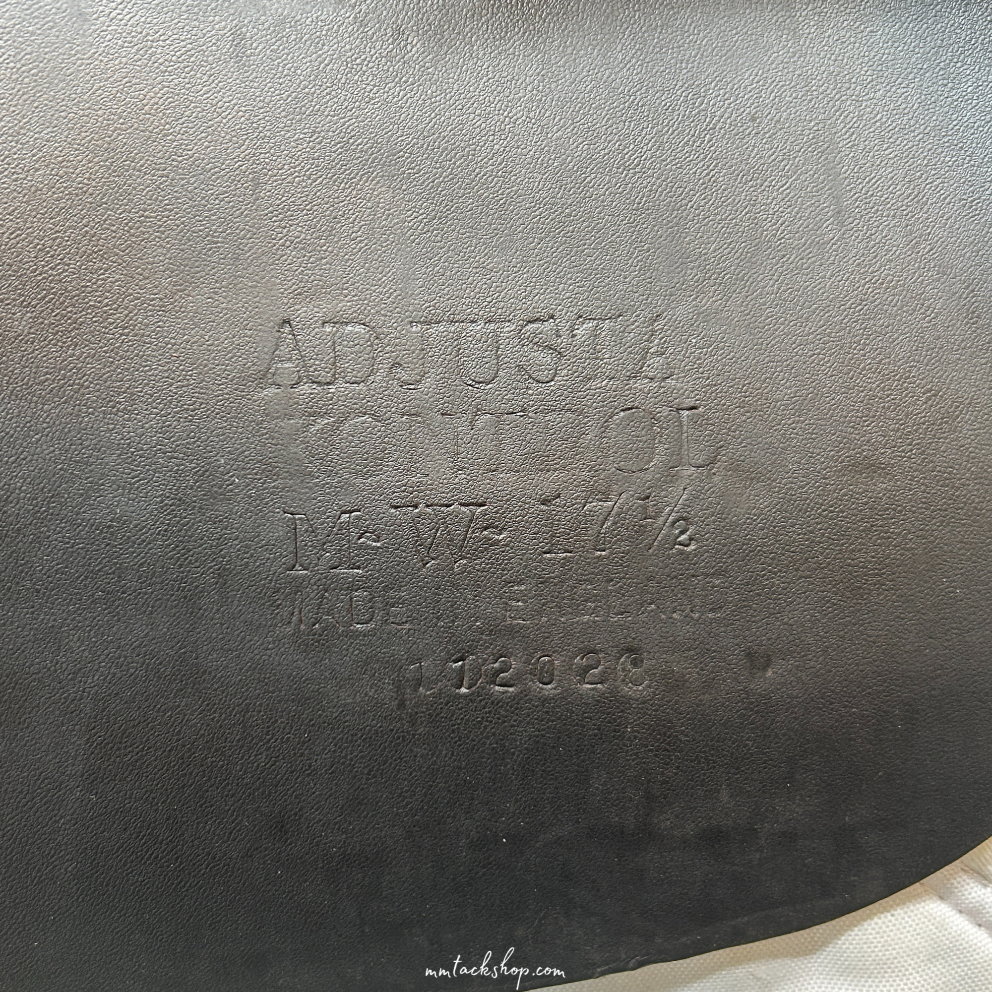 Close up of the serial number on a dark Havana demo 17.5", flat forward, medium wide Albion jump saddle.