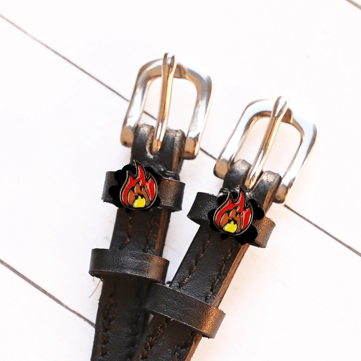 Equestrian spur straps with Mane Jane Flame charms.