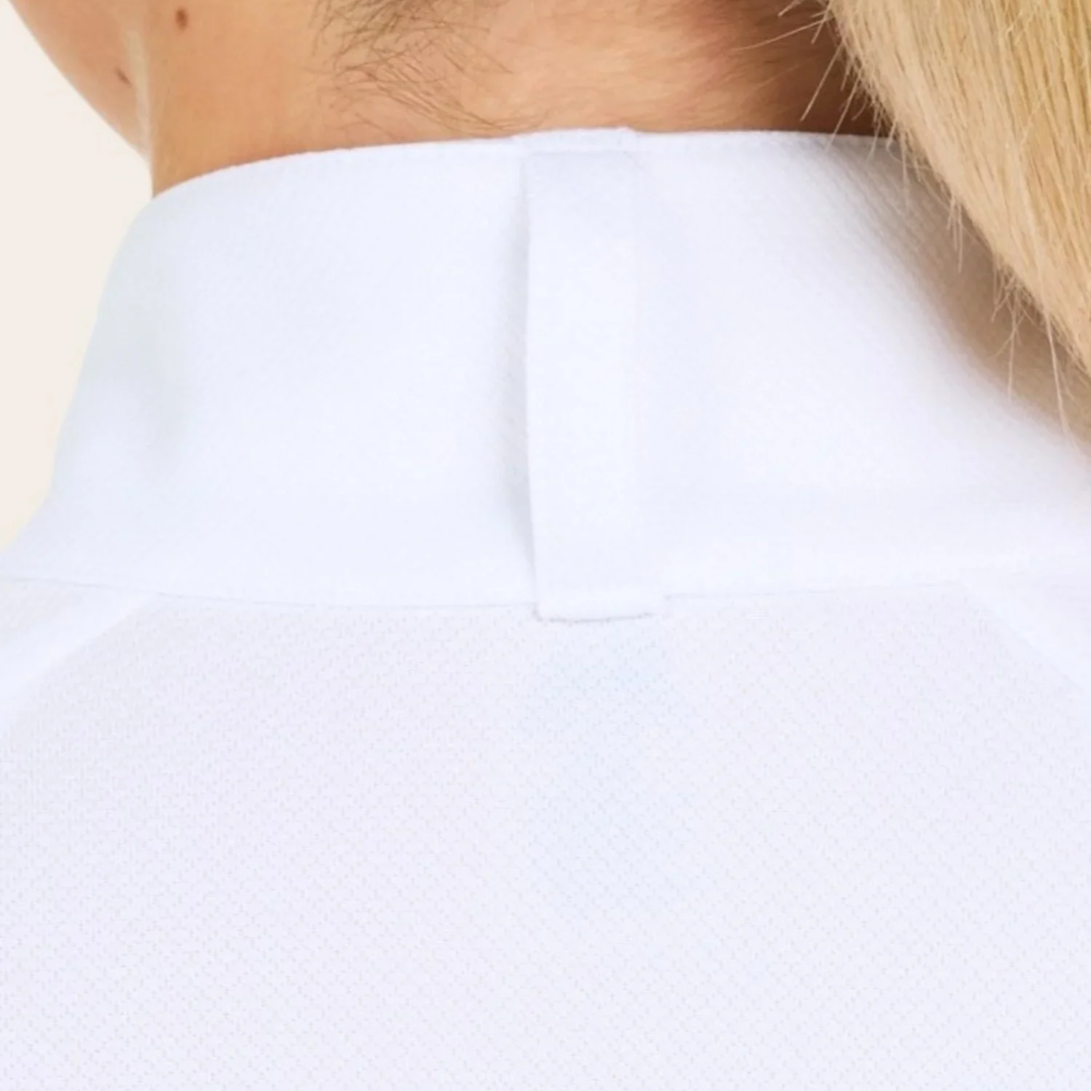 A woman wearing the RJ Classics Sofia Plus Show Shirt in White. Featuring a 1/4 zip with two button collar closure.