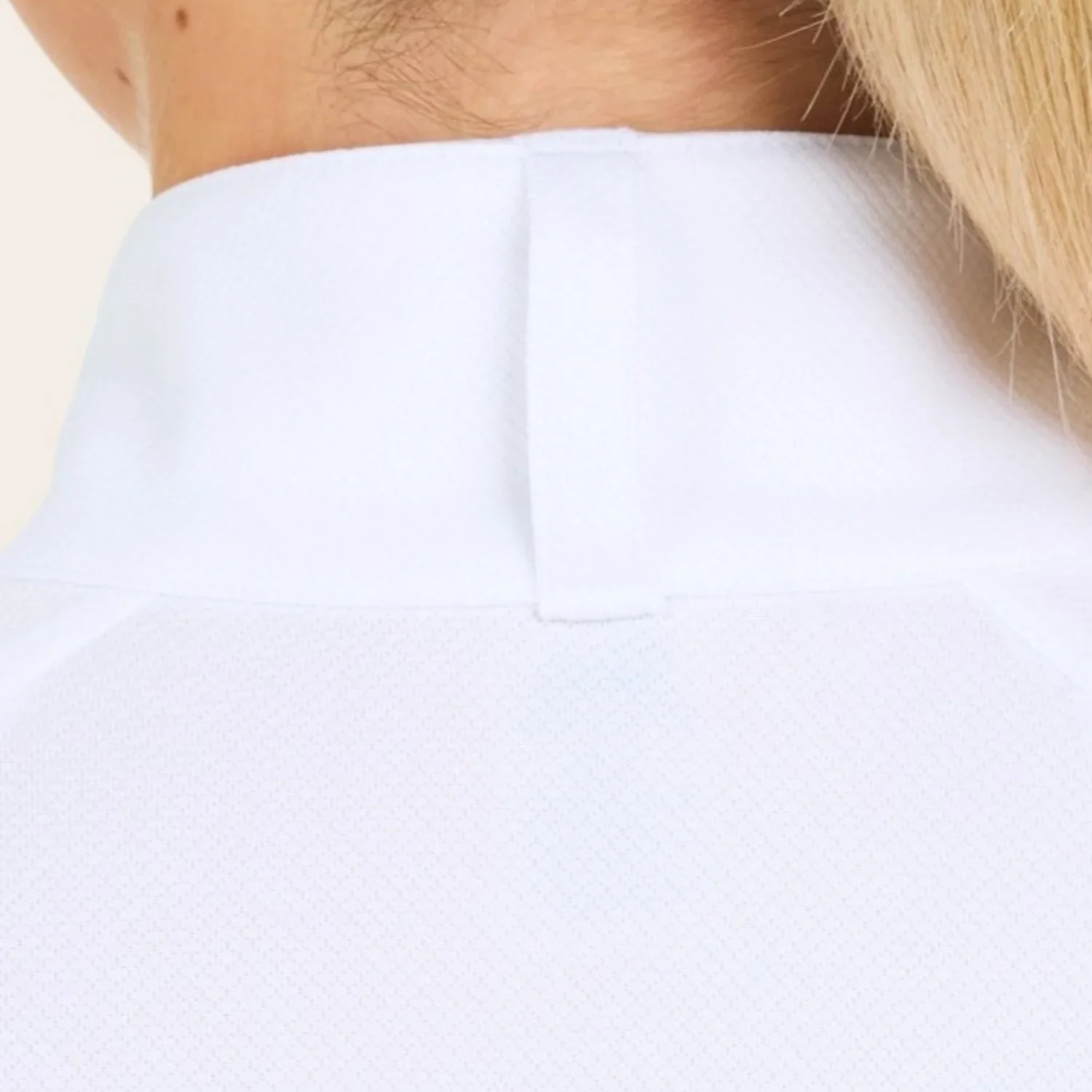 A woman wearing the RJ Classics Sofia Plus Show Shirt in White. Featuring a 1/4 zip with two button collar closure.