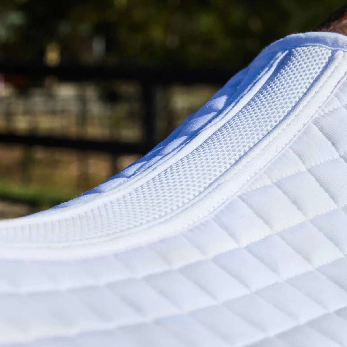 Close up of the Weatherbeeta Air Tec Dressage Pad in White.