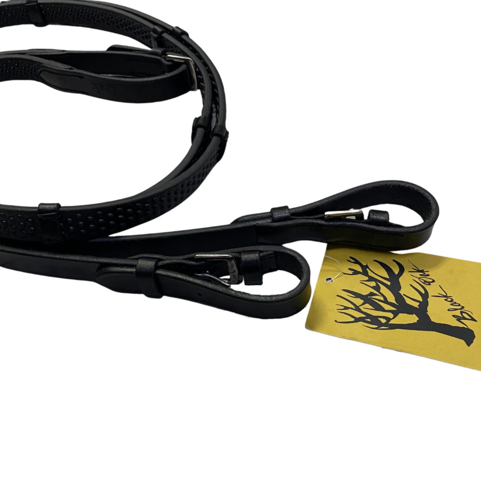A close up of the buckle ends of the Black Oak Pebble Grip reins.