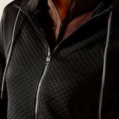 Close-up of a black patterned Ariat Radiance Full Zip with a brand logo on a neutral background