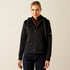 Woman wearing a black Ariat Radiance Full Zip quilted jacket on a beige background.