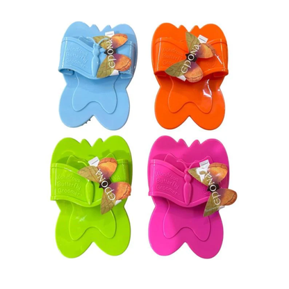 Four colorful butterfly-shaped Epona Wondrous Curry Groomers on a white background. Top row has blue and orange and bottom row has green and pink.