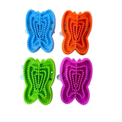 Four colorful butterfly-shaped Epona Wondrous Curry Groomers on a white background. Top row has blue and orange and bottom row has green and pink.