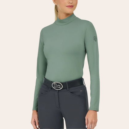 Front image of R.J. Classics Jemma iceberg green mock neck shirt on a blonde model wearing navy breeches. 