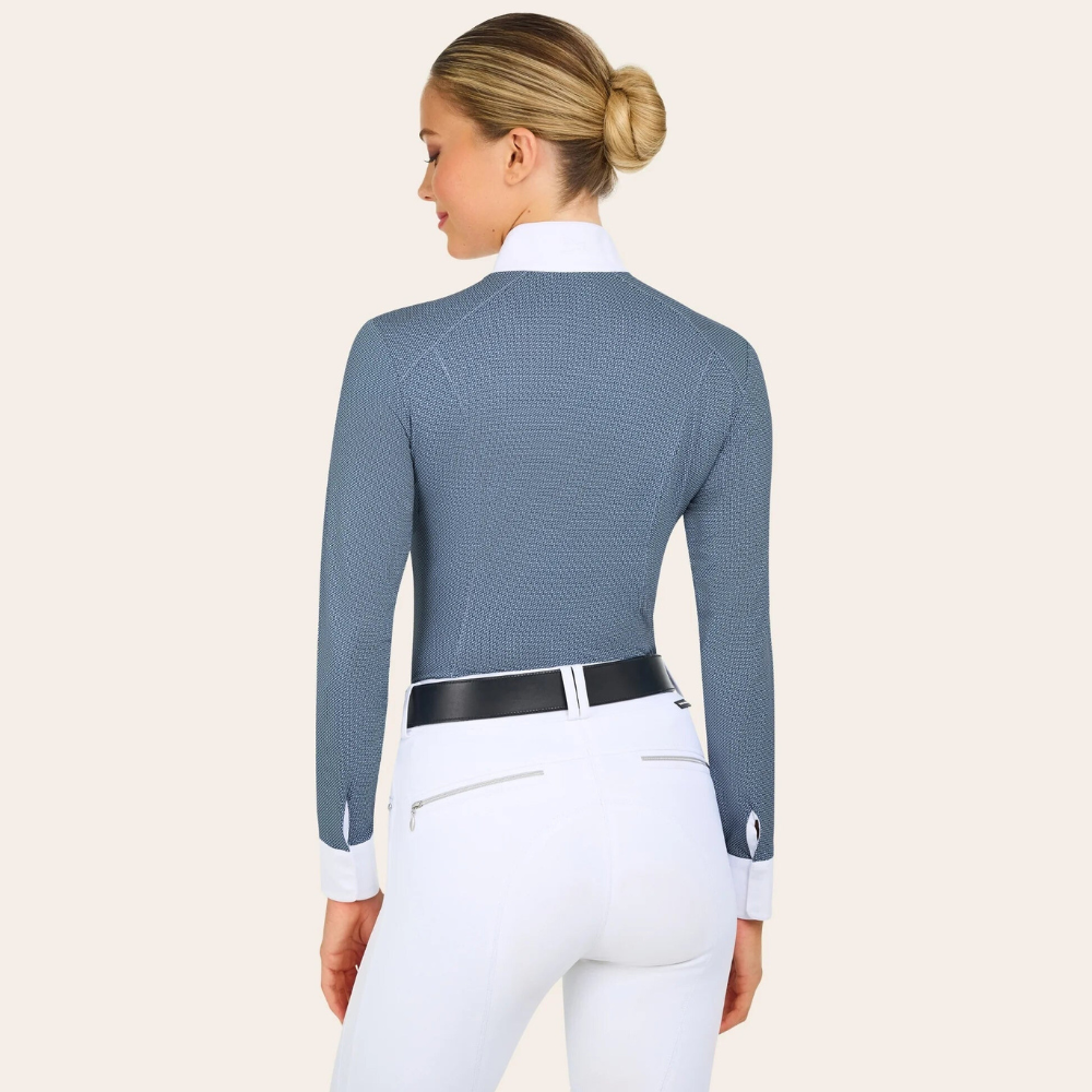 Product image of the back of R.J. Classics blue petal dots Liv show shirt on a model wearing white breeches and a black R.J. Classics belt. 