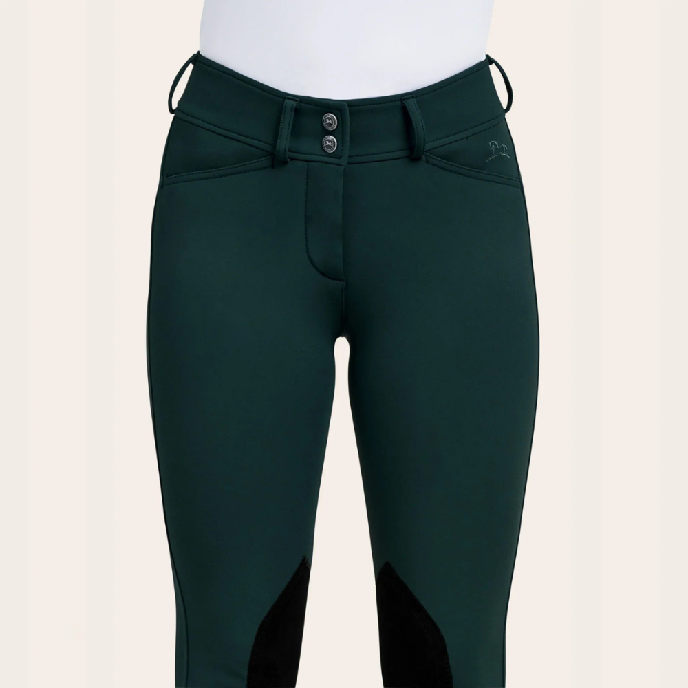Closeup image of the front of R.J. Classic forest colored Gracie knee breeches on a model.