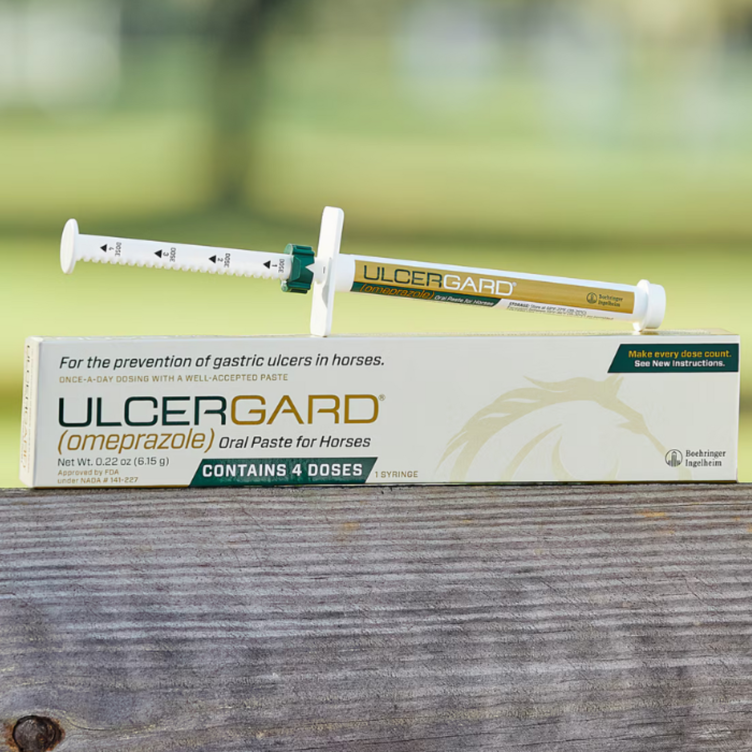 A tube of UlcerGard horse supplement with a syringe, placed in front of its packaging box.