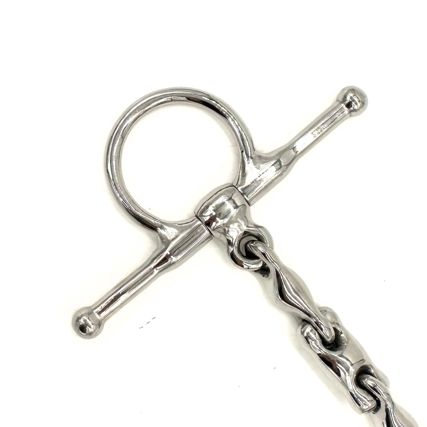 Close up view of the cheekpiece of an AJR Sport Pony Locking Waterford D Bit on a white background. 