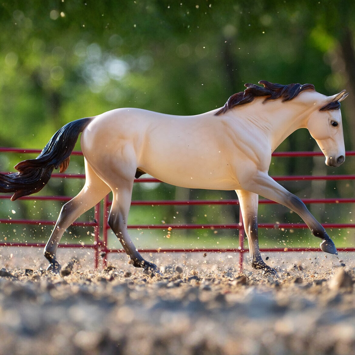 Breyer Horse model of Cash the Quarter Horse. The model resembles a dun/buckskin quarter horse galloping.