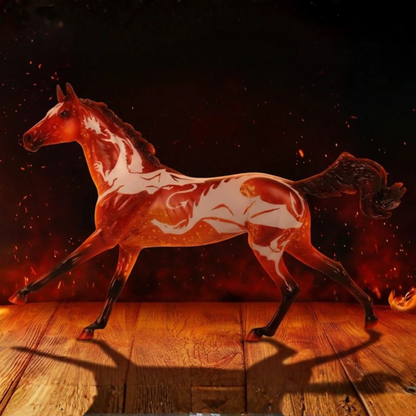 A stylized Breyer running horse model with a glossy reddish-brown and white marbled dragon pattern, standing on a wooden surface against a dark fiery background with glowing embers.