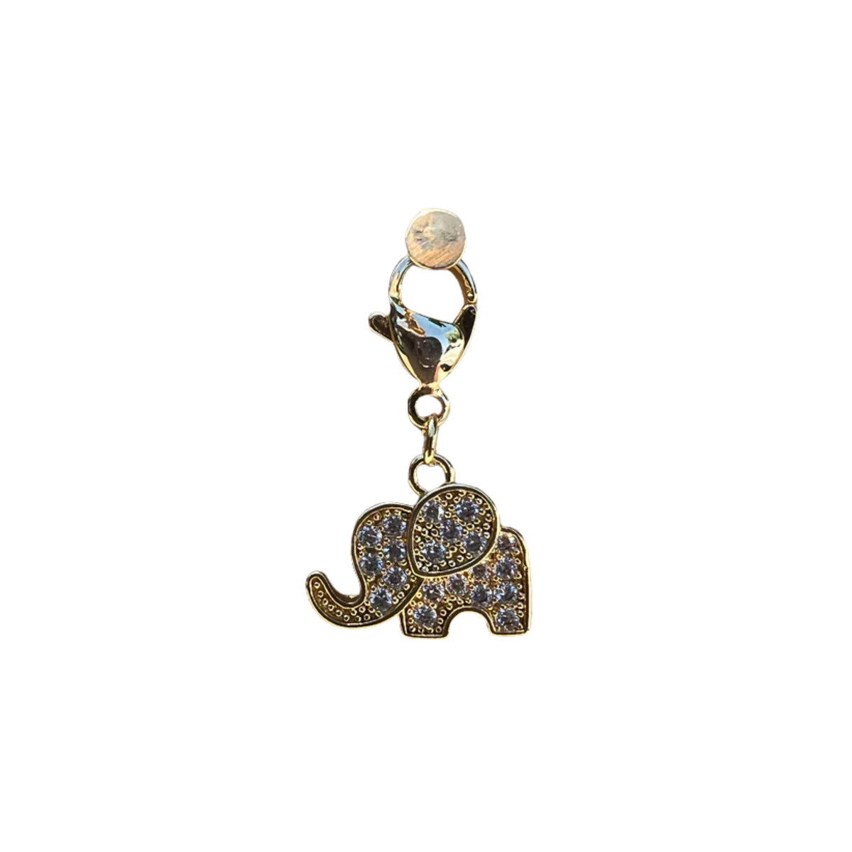 Gold elephant charm with clear stones on a white background
