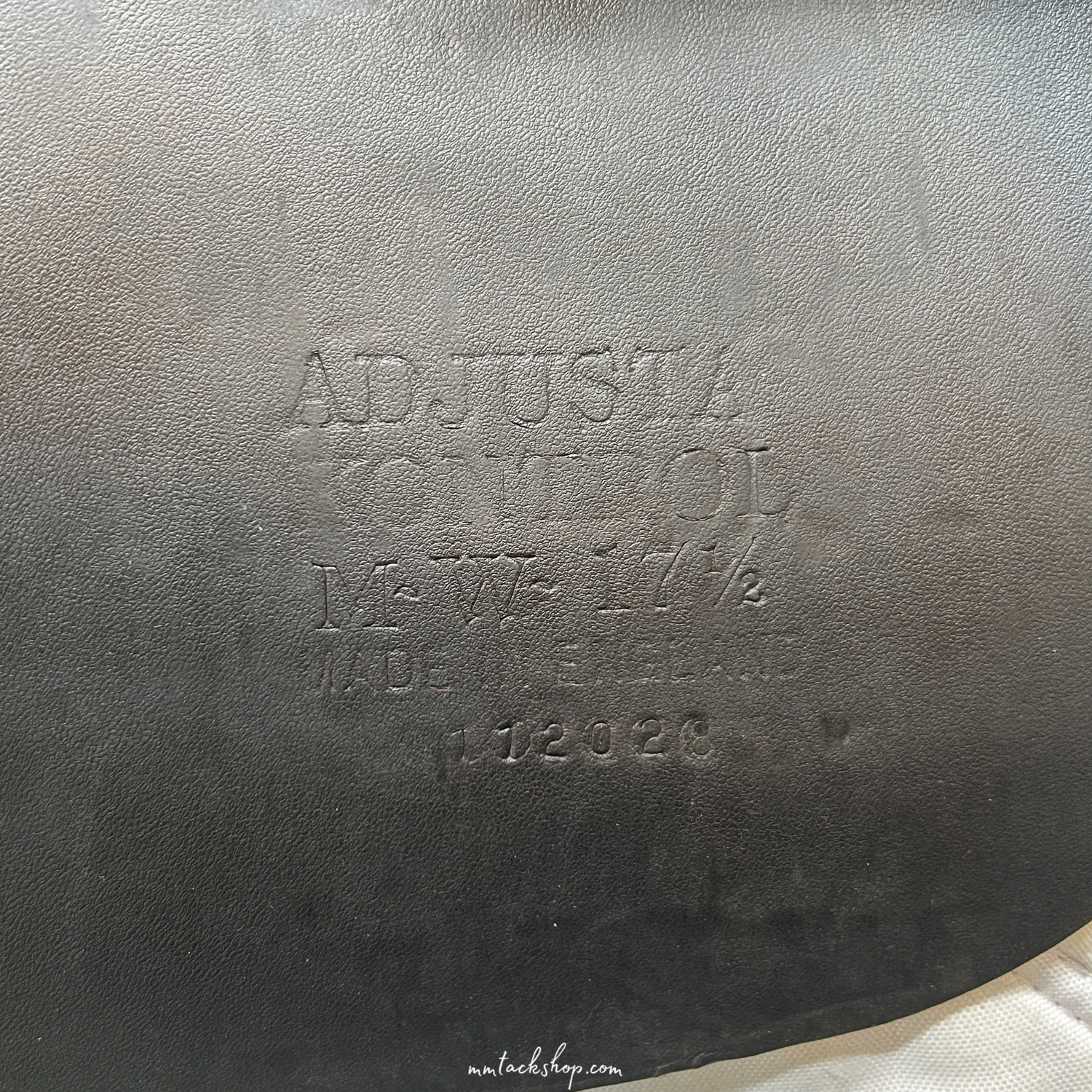 Close up of the serial number on a dark Havana demo 17.5", flat forward, medium wide Albion jump saddle.