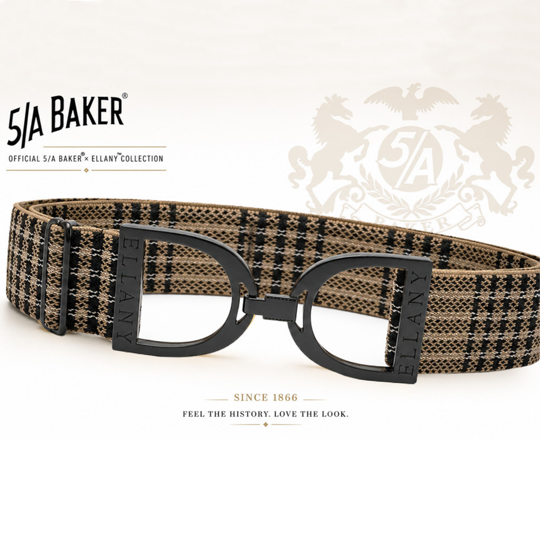 A 5/A Baker x Ellany collection elastic belt with a black and beige plaid pattern and black metal stirrups buckle, displayed on a clean white background with Baker brand logos.