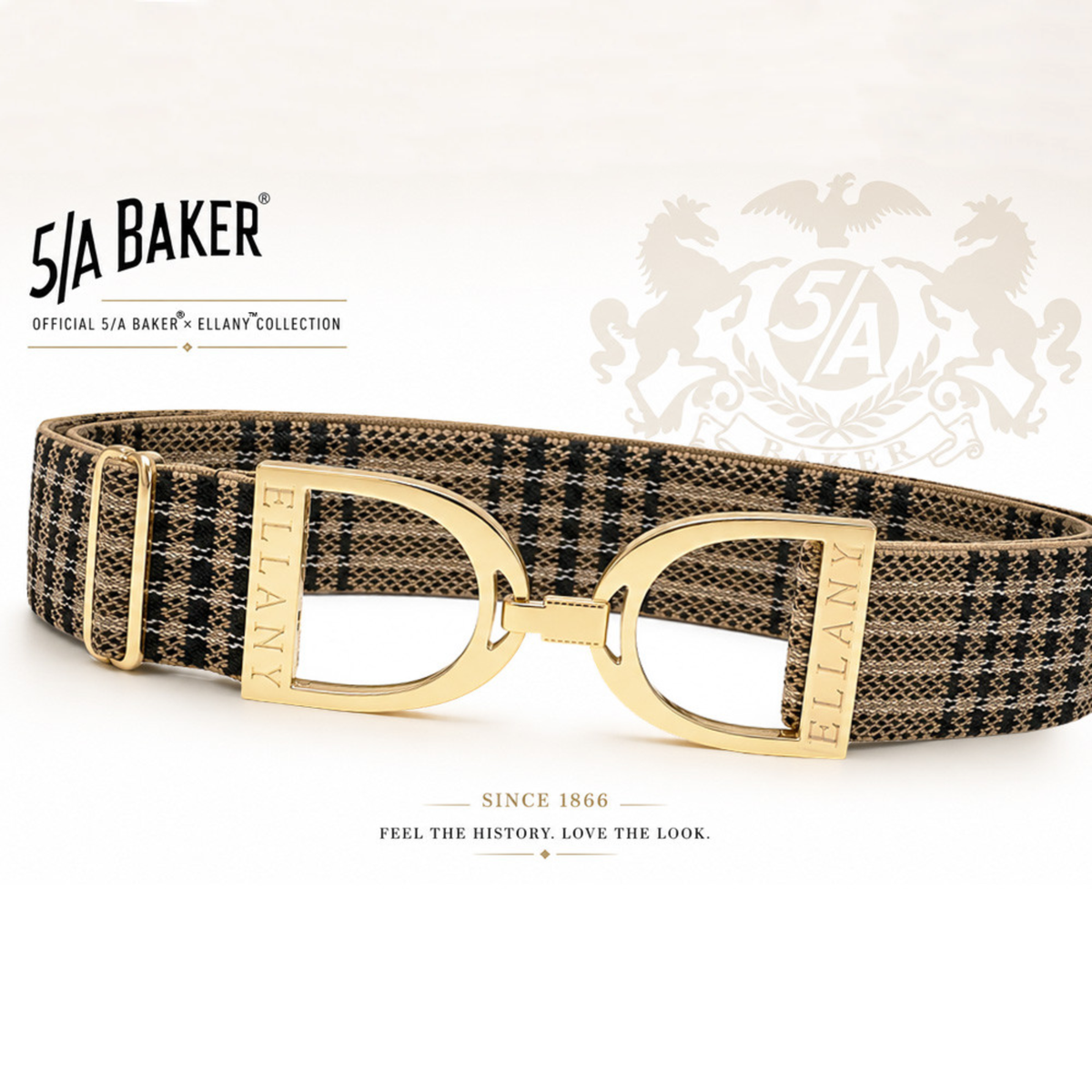 A 5/A Baker x Ellany collection elastic belt with a black and beige plaid pattern and gold metal stirrups buckle, displayed on a clean white background with Baker brand logos.