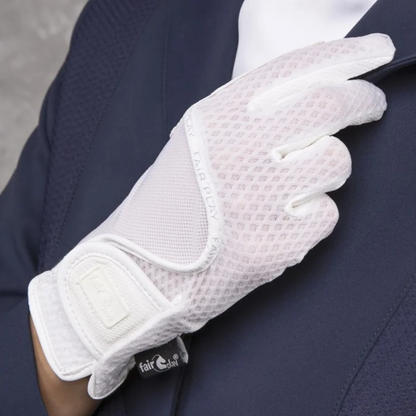 A close-up of a white Fair Play LOLA equestrian riding glove with  breathable mesh backing , worn on a hand resting on a navy blue show coat.