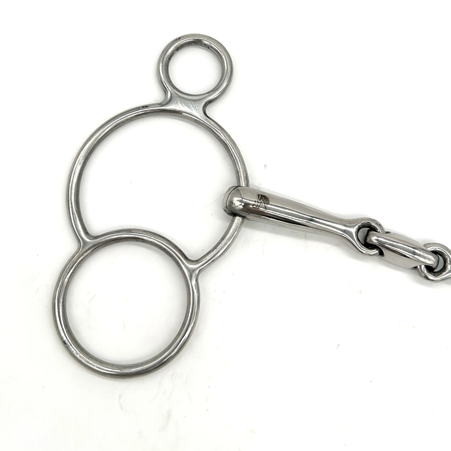 Closeup of the cheekpiece of a Jake Adams Equestrian Locking Elliptical Two Ring bit on a white background.