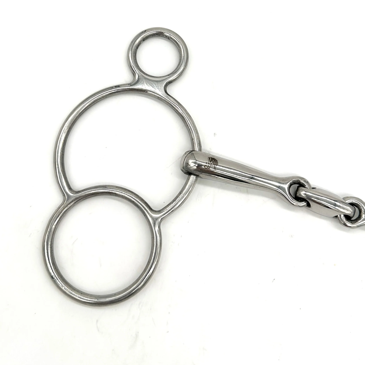 Closeup of the cheekpiece of a Jake Adams Equestrian Locking Elliptical Two Ring bit on a white background.