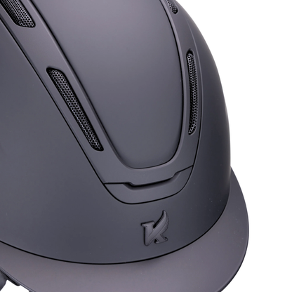 Close-up of a matte black Karben Amity SMRT equestrian riding helmet with the Karben brand logo on a white background.