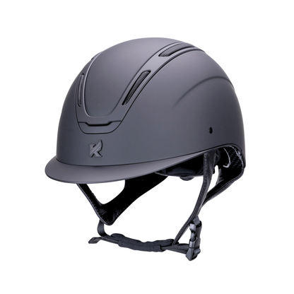 A matte black Karben Amity SMRT equestrian riding helmet with a visor and black chin strap shown from a three-quarters angle on a white background.