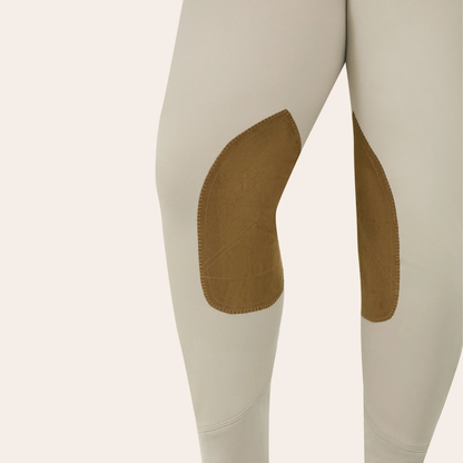 A model wearing the RJ Classics Gracie Plus Breech in Sand color. Close up of the suede knee patch.