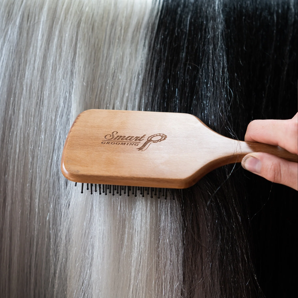 Smart Grooming Small Mane &amp; Tail Brush detangling a horse’s tail.