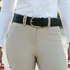 Lifestyle image of a black Tailored Sportsman Quilted C Black belt being worn with beige breeches and a white shirt.