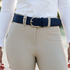 Lifestyle image of a navy Tailored Sportsman Quilted C Black belt being worn with beige breeches and a white shirt.