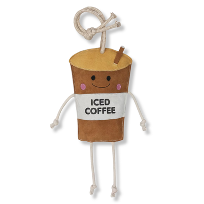 A plush coffee cup character stall toy with a smiling face, pink cheeks, rope arms and legs, and a straw, with the words &