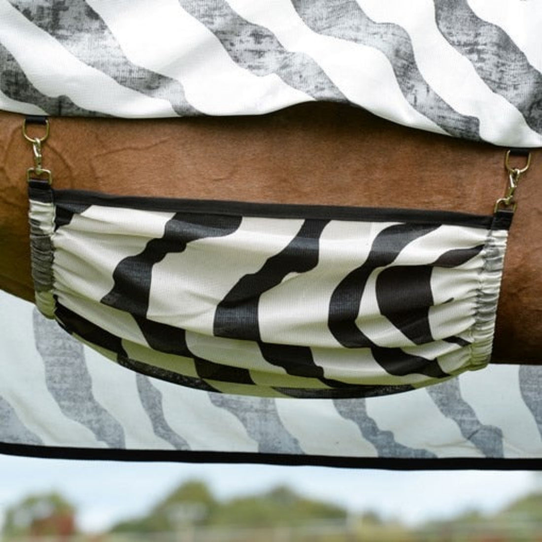 The belly band of a zebra fly sheet.