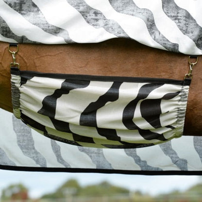 The belly band of a zebra fly sheet.