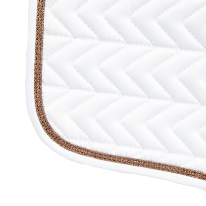 Gold glitter detail on edge of white dressage saddle pad.
