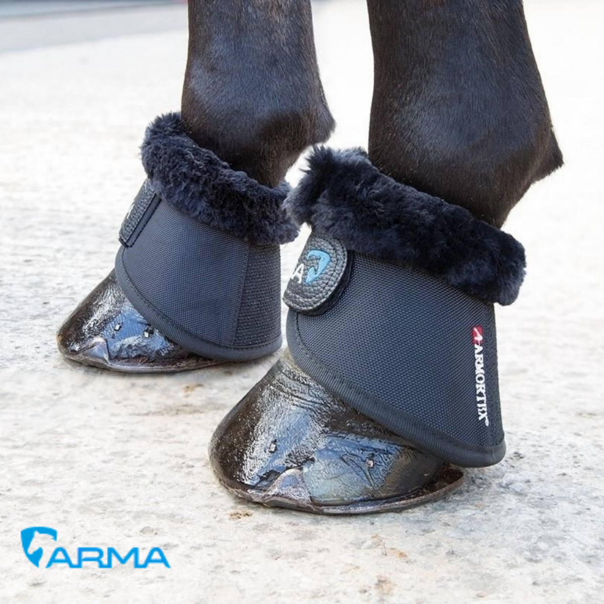 Horse wearing black ARMA Supafleece Over Reach Boots with SupaFleece trimming around the pasterns.